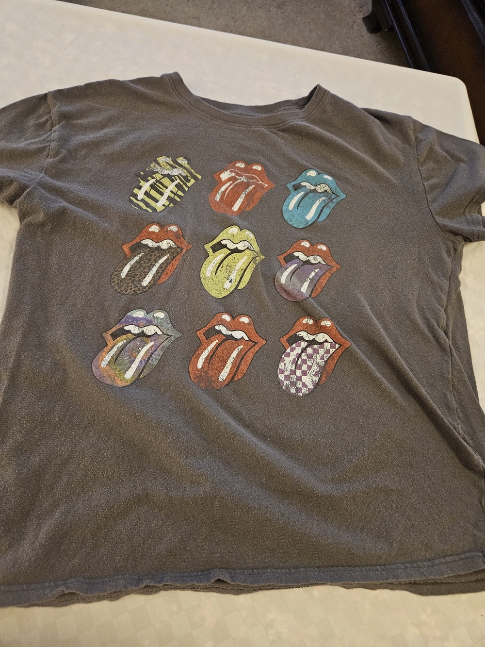 the Rolling Stones Black Short-Sleeve Tee with Multicolor Tongue Logos